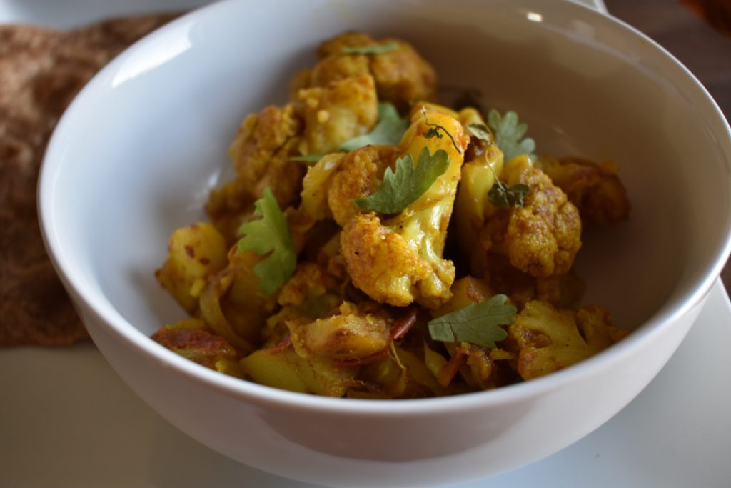 Bowl of aloo gobi a north Indian curried cauliflower and potato dish