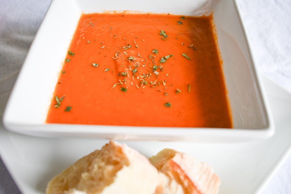 Bowl of Tomato Basil Soup with French Bread