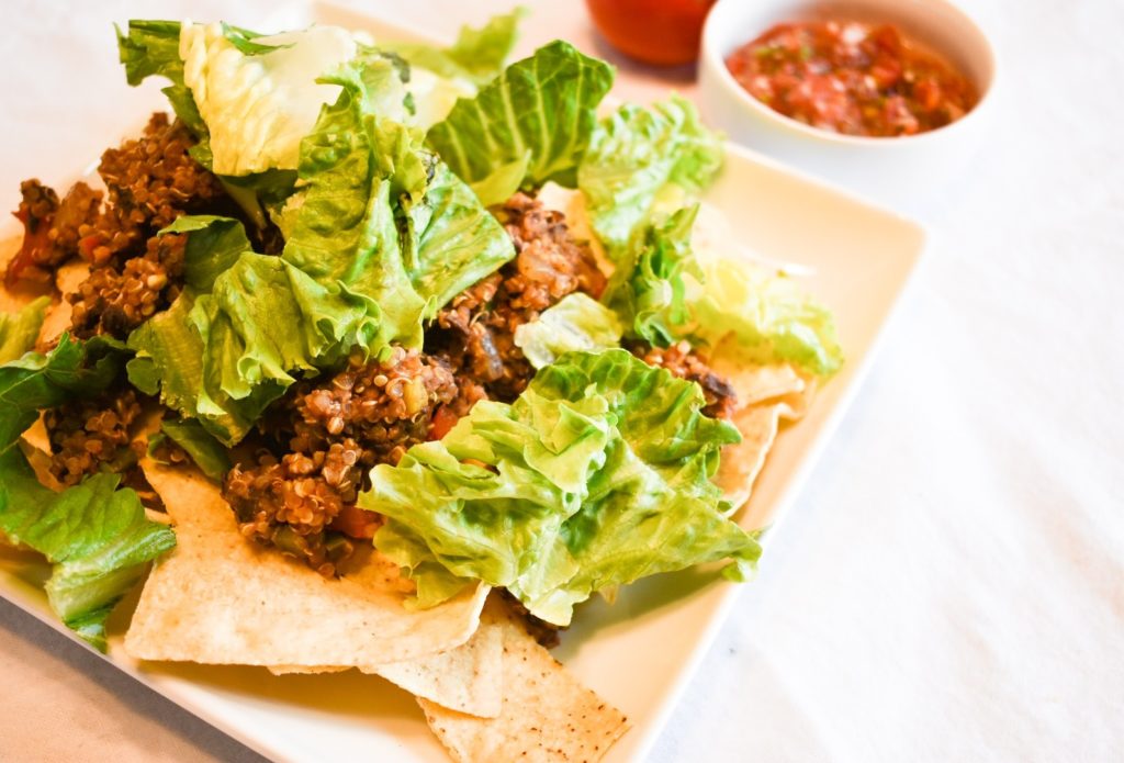 Plate of Quinoa Black Bean Taco filling nachos with salsa