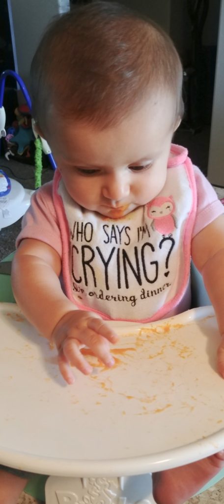 baby eating homemade carrot puree