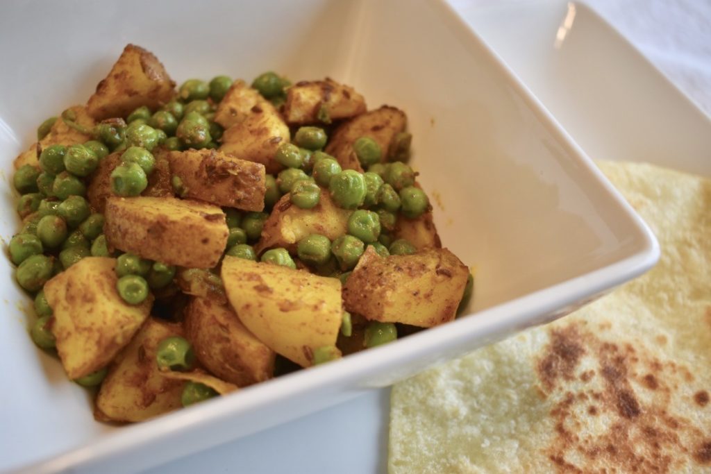 Indian curried potatoes and peas (aloo mutter jeera)