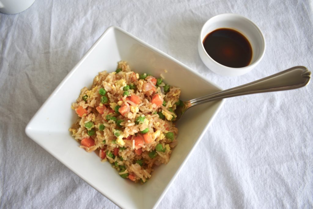 Bowl of Vegetarian Teriyaki Fried Rice with a side of soy sauce